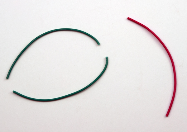 Cut the green jumper wire into two pieces