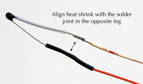 Position heat shrink after completing second solder joint